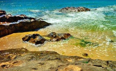 Beautiful landscape with rocks and sea waves on a sunny beach