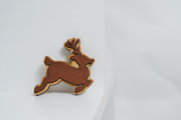 Hand made wooden deer on white background, Christmas bauble