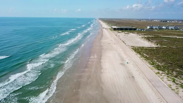 Aerial view footage by drone of the shoreline of Packery Channel Jetty, Padre Island, Texas, 4K