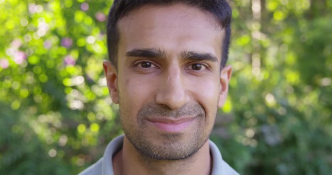 Close Up - Handsome man looks into the camera and smirks - Slow Motion - shot on RED