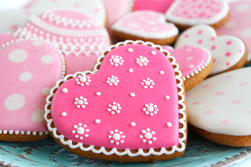 Set of pink heart shaped cookies with patterns, handmade