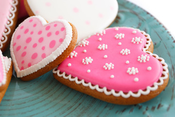 Obraz na płótnie Canvas Set of pink heart shaped cookies with patterns, handmade