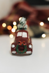 Christmas decoration, red car with snowman and Christmas tree 
