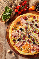 Meat pizza on wooden table