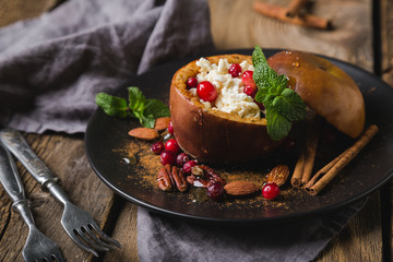 Baked apple with cottage cheese, berries and honey. Healthy dessert