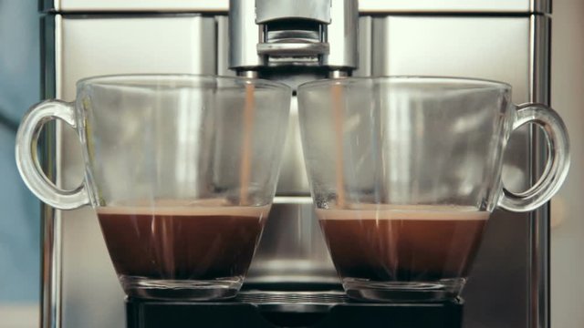 Preparation of natural delicious coffee in the automatic coffee machine. A charge of vivacity every day. Good morning.