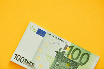 Euro Money Banknotes on a yellow background