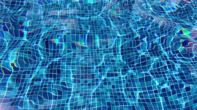 Abstract background, water waves and lines of blue tile in hotel swimming pool with shiny sunlight reflection. Summer and holidays concept.