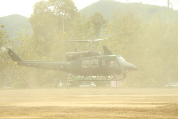 rotary wing aircraft, were landed, grass, dirt and grass, clouded, throughout the park.
