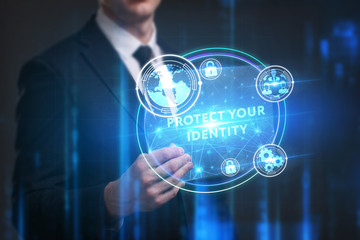 Business, Technology, Internet and network concept. Young businessman working on a virtual screen of the future and sees the inscription: Protect your identity