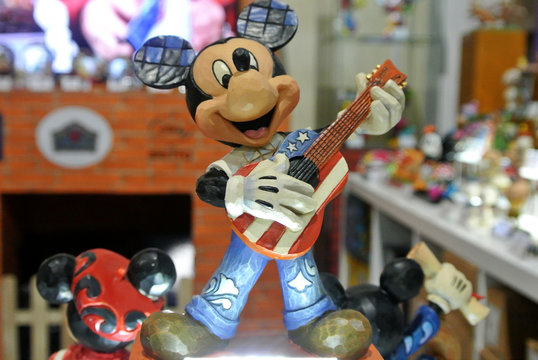 KUALA LUMPUR, MALAYSIA -APRIL 8, 2018: Fictional cartoon character from Disney called Mickey Mouse. Collector item of Mickey Mouse action figure display on a table. 
