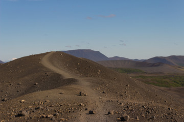 Small path in dark sand desert mountains, with rocks, Volcanic desolate landscape of Iceland