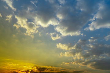 Fototapeta premium Abstract of sky gold mix blue color, with the sun and clouds in the evening.