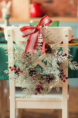 Christmas decor in kitchen. Christmas tableware. Christmas cooking utensils. Bright interior of New Year's cuisine. New Year card template. White Mint Colors Kitchen. Christmas tree in the kitchen.