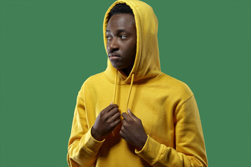 young black man in yellow hoodie