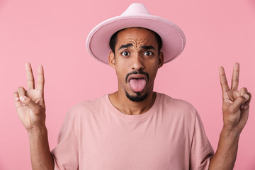 Photo of scared african american man gesturing peace sign