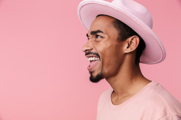 Photo of excited african american man smiling and screaming