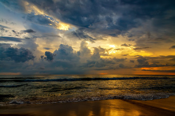Fototapeta na wymiar sunset among clouds and blue sky over ocean, tropical country, Sri Lanka, warm.