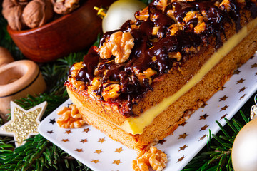 Chocolate gingerbread with filling, jam and nuts