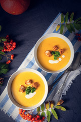 Delicious pumpkin soup with croutons and coconut milk