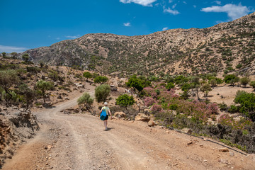 Fototapeta premium Traveler on the road to Agio Farango Gorge