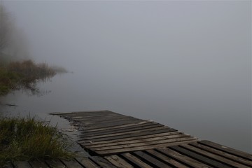  ruined pier on a foggy lake