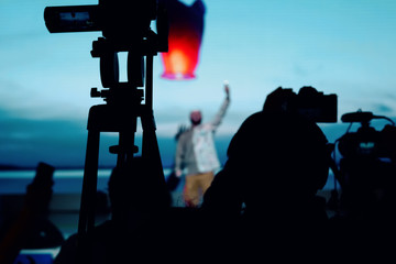 Fototapeta premium silhouette group of cameramen at an event
