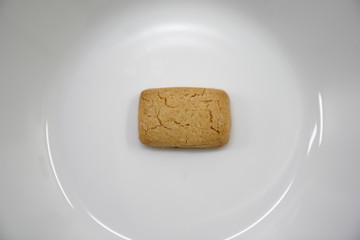 piece of butter cookies on white dish