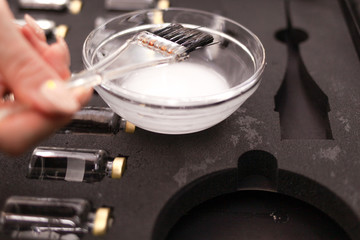 Cosmetologist prepares hair mask for his client. Botox for hair