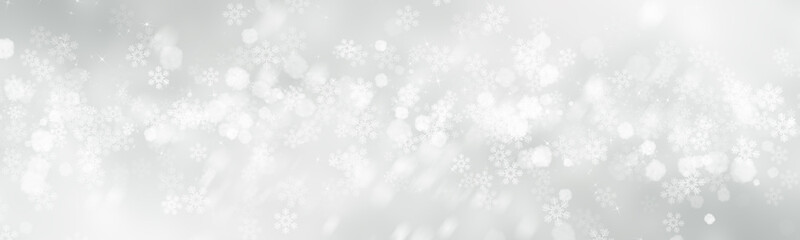 Fototapeta premium white and gray Christmas light with snowflake bokeh background, Winter backdrop wallpaper.