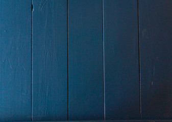 Dark blue wooden background. Painted wood texture. Background photo with space for text.