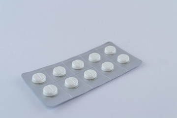 Thermometer for body temperature. Drugs, pills and capsules isolated on white background. Yellow...