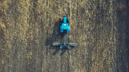 Land cultivation. Tractor in the field preparing the land for sowing