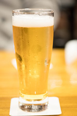 Chilled glass of light beer