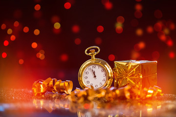Festive holiday background with clock showing Midnight at New Years Eve.