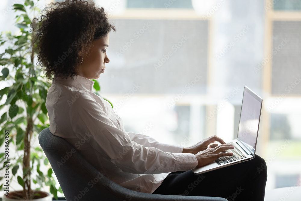 Canvas Prints focused african american woman work on laptop in office