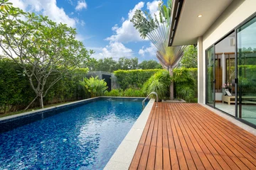 Foto auf Acrylglas swimming pool and decking in garden of luxury home © Stock PK