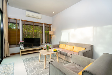 living room with pool view in luxury home