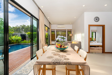 living room with pool view in luxury home