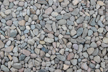 Pebbles of different shape, size, color and origin as a background