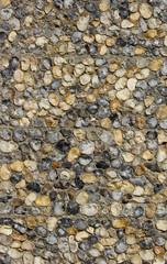 A texture of a pebble stone wall made of natural stones