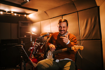 Portrait of a guitarist making funny face.