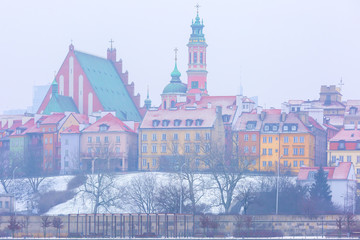 Royal Castle and colorful houses by the Vistula River in Warsaw, Poland.