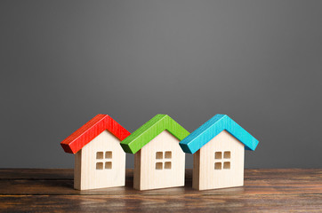 Multi-colored wooden houses. Affordable comfortable housing. Purchase of apartments and real...