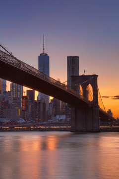 Brooklyn Bridge and New York City skyline at sunset