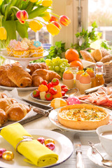 Table with delicatessen ready for Easter brunch - 305974028