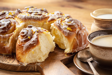 Homemade lemon sweet swirl buns, on wooden background.