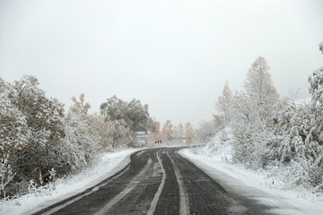 scenic view of empty road with snow covered landscape while snowing in winter season.turkey