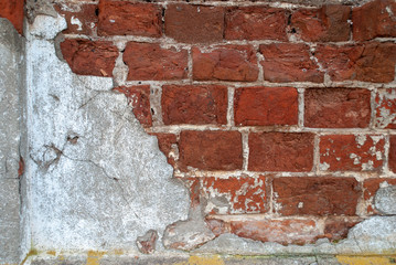 texture of old brickwork with remnants of cement plaster