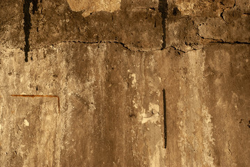 texture of concrete wall slightly illuminated by the sun